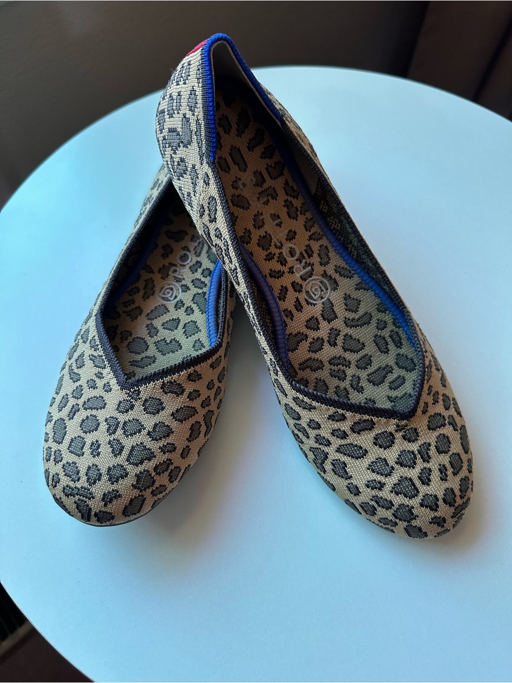 Rothy's Leopard Print Ballet Flats in Tan and Black with Blue Trim